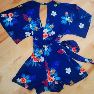 Blue floral romper with waist tie, size medium
